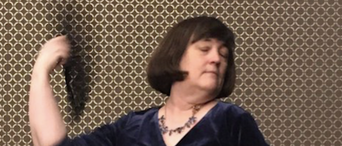 Image of Marian Wilson Kimber Reciting with Fan.