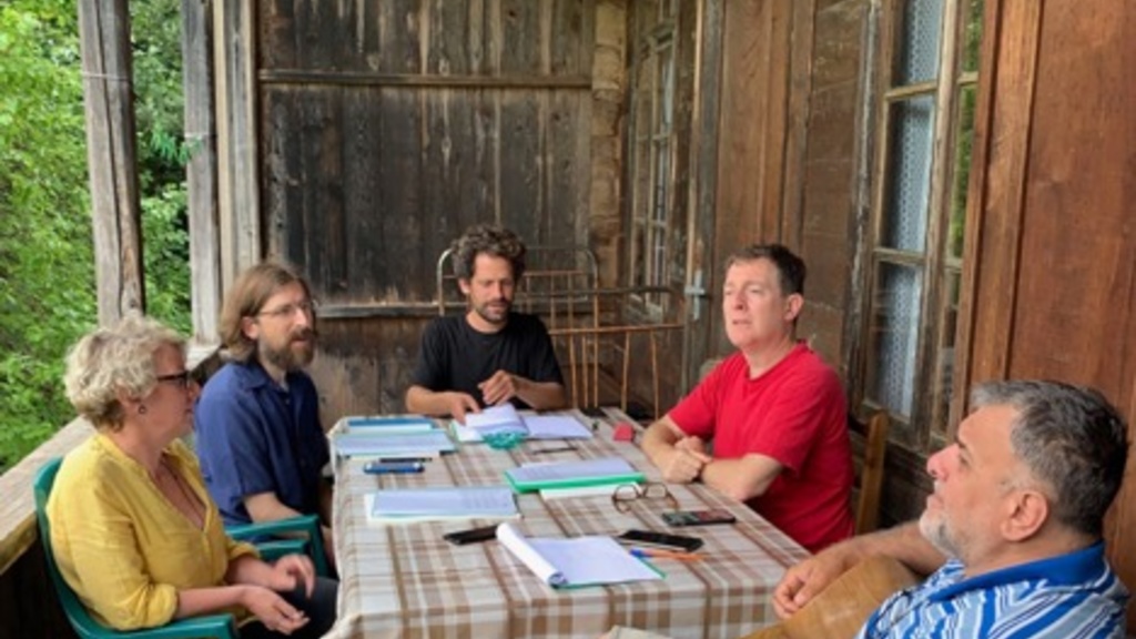Image of Matthew Arndt sitting with Singing Workshop Participants in Western Georgia