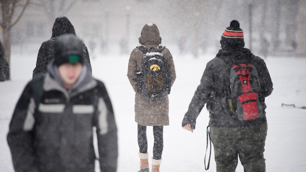 Students Walking in the Snow on the University of Iowa Campus. 